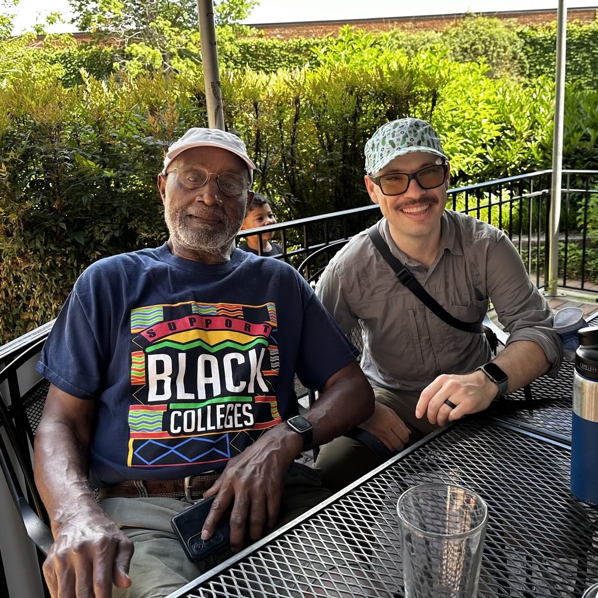 An image of Braxton Foushee seated with Cristóbal Palmer